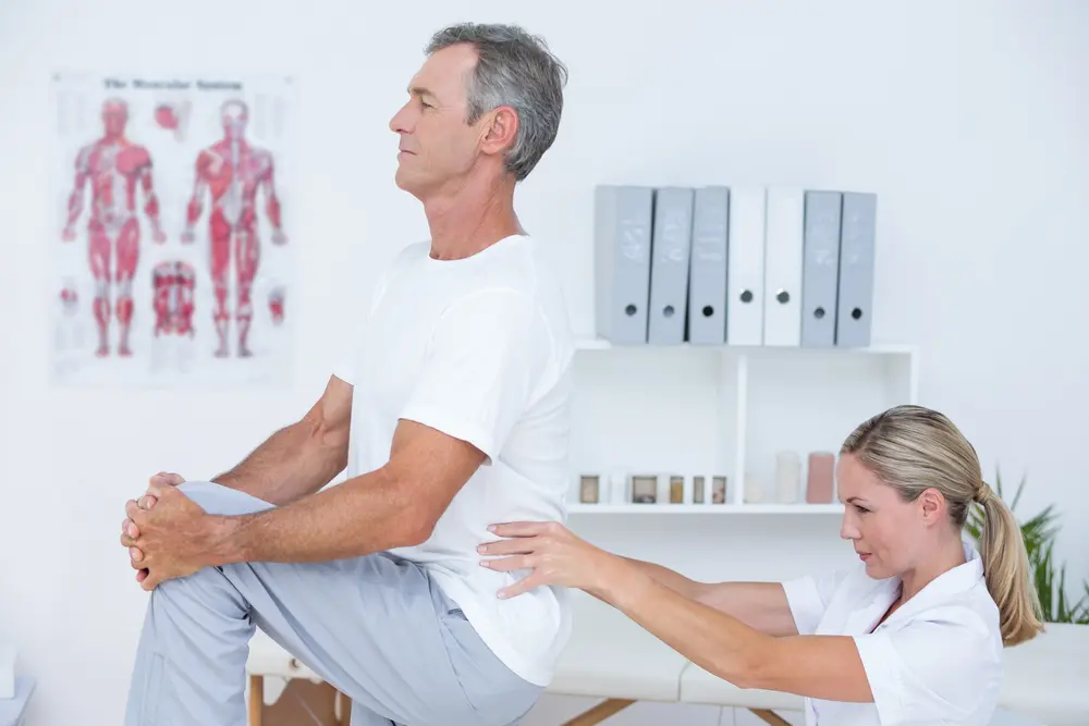 Female-osteopath-check-patient-back-problems