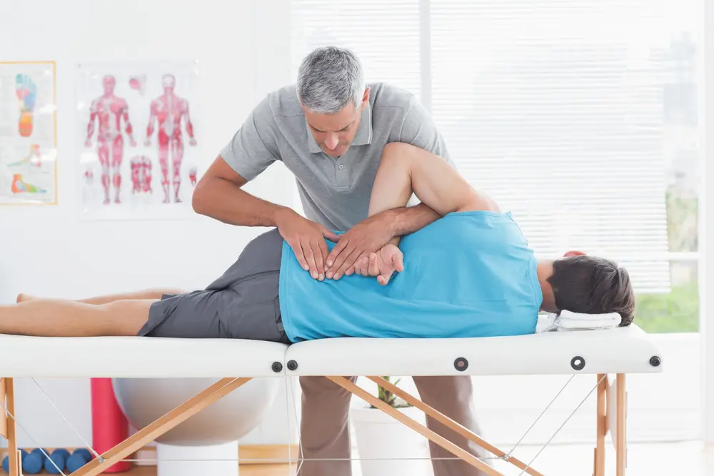 Osteopathic-Practitioner-treating-patient-with-back-pain