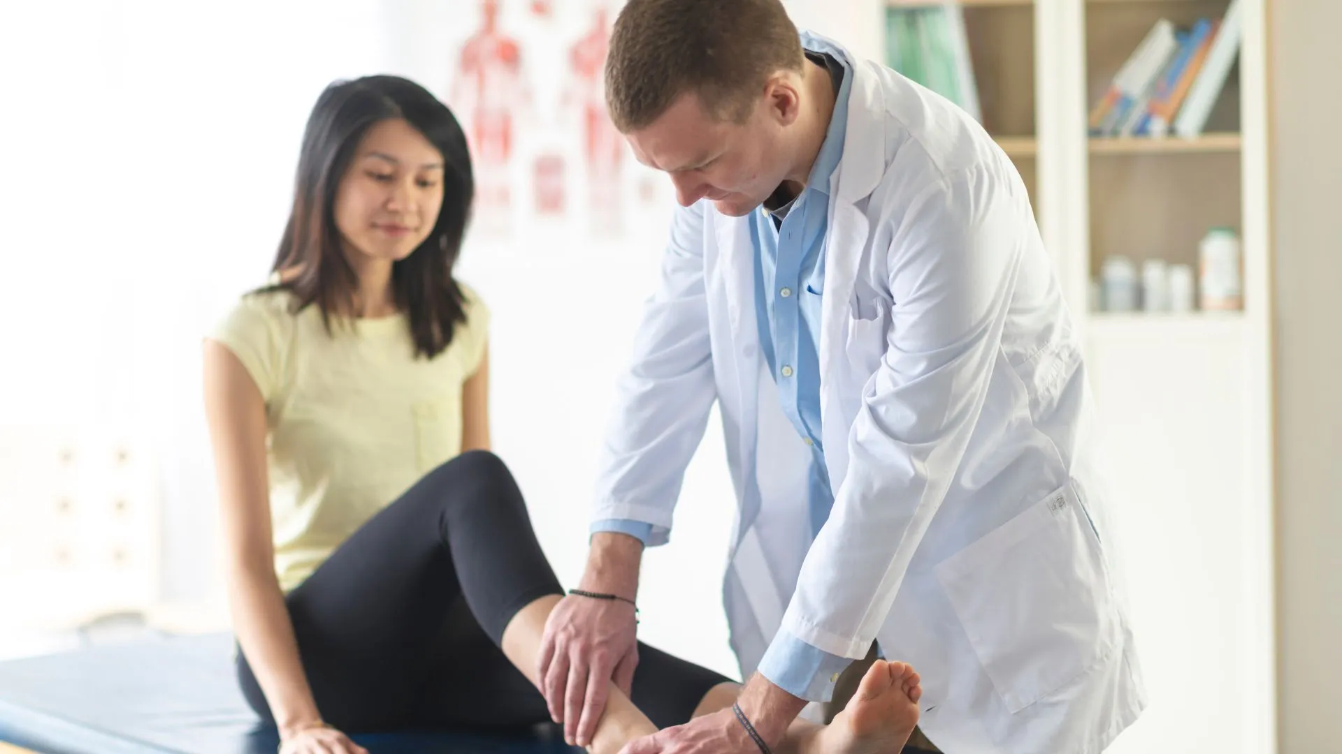 Osteopathy-practitioner-treating-Patient-with-Ankle-Pain